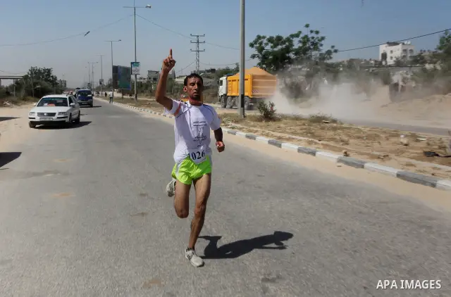 Palestinians Participant compete "Marathon of Return" near to the Erez crossing in the northern Gaza Strip on May 12, 2012. The Nakba commemorations mark the uprooting of Palestinians who fled or were driven out of their...