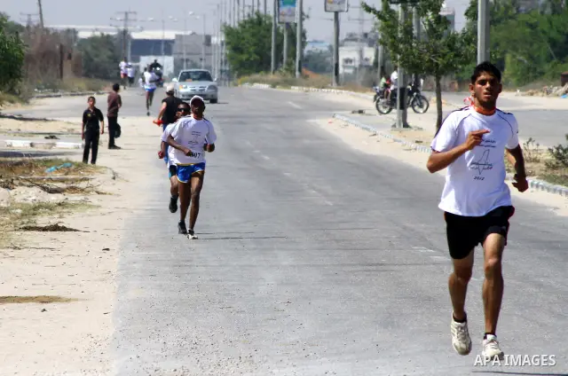 Palestinians Participant compete "Marathon of Return" near to the Erez crossing in the northern Gaza Strip on May 12, 2012. The Nakba commemorations mark the uprooting of Palestinians who fled or were driven out of their...