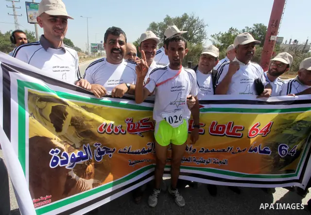 Palestinians Participant compete "Marathon of Return" near to the Erez crossing in the northern Gaza Strip on May 12, 2012. The Nakba commemorations mark the uprooting of Palestinians who fled or were driven out of their...