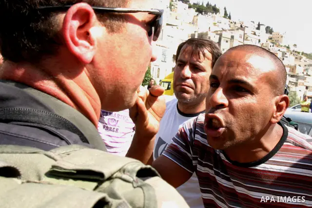 A Palestinian man scuffle with Israeli police, after arresting a Palestinian during clashes between Palestinian youth and the Israeli police in the east Jerusalem neighbourhood of Silwan on May 12, 2012. Israel is to rep...