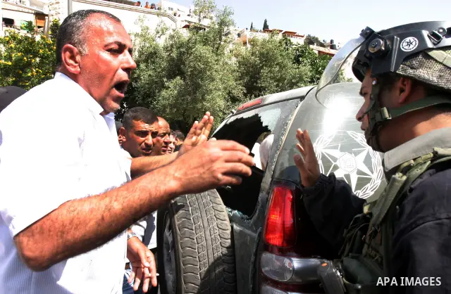 A Palestinian man scuffle with Israeli police, after arresting a Palestinian during clashes between Palestinian youth and the Israeli police in the east Jerusalem neighbourhood of Silwan on May 12, 2012. Israel is to rep...