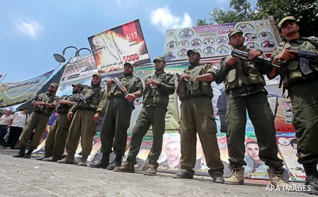 Palestinian police stand in the center of Gaza city during a protest, to show solidarity with Palestinian prisoners held in Israeli jails, May 13, 2012. Hundreds of Palestinians on hunger strike in Israeli jails said on...