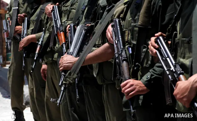 Palestinian police stand in the center of Gaza city during a protest, to show solidarity with Palestinian prisoners held in Israeli jails, May 13, 2012. Hundreds of Palestinians on hunger strike in Israeli jails said on...