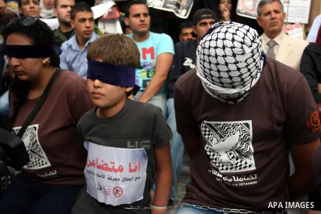 Palestinians take part in a rally in support of Palestinian prisoners holding a hunger strike in Israeli prisons, in the West Bank city of Ramallah May 13, 2012. Palestinian president Mahmud Abbas warned of a "national d...