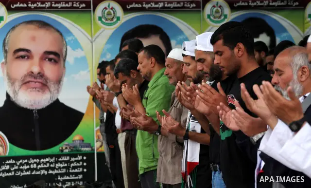 Palestinians take part in mass prayer during rally to show solidarity with prisoners held in Israeli jails, in Gaza City May 14, 2012. One in three of the 4,800 Palestinians serving time in Israeli jails began refusing f...