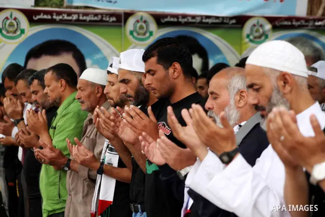 Palestinians take part in mass prayer during rally to show solidarity with prisoners held in Israeli jails, in Gaza City May 14, 2012. One in three of the 4,800 Palestinians serving time in Israeli jails began refusing f...