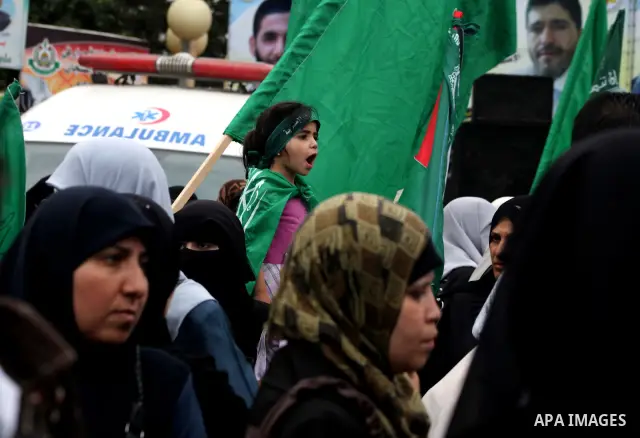 Palestinian women hold pictures of incarcerated relatives in a rally to show solidarity with prisoners held in Israeli jails, in Gaza City May 14, 2012. One in three of the 4,800 Palestinians serving time in Israeli jail...