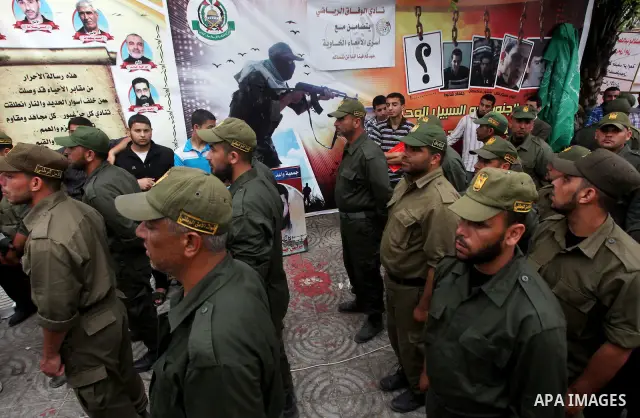 Palestinian Hamas police officers take part in a rally to show solidarity with prisoners held in Israeli jails, in Gaza City May 14, 2012. One in three of the 4,800 Palestinians serving time in Israeli jails began refusi...