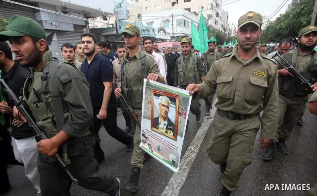 Palestinian Hamas police officers take part in a rally to show solidarity with prisoners held in Israeli jails, in Gaza City May 14, 2012. One in three of the 4,800 Palestinians serving time in Israeli jails began refusi...