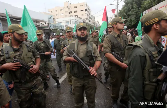 Palestinian Hamas police officers take part in a rally to show solidarity with prisoners held in Israeli jails, in Gaza City May 14, 2012. One in three of the 4,800 Palestinians serving time in Israeli jails began refusi...