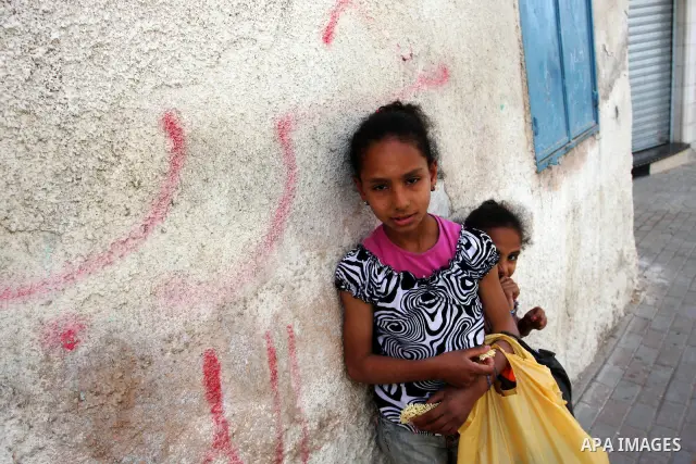 Palestinian children play at the street, a day before Palestinians mark the 'Nakba' Day (Day of the catastrophe), in the Al Jalazoun refugee camp in the West Bank City of Ramallah on 14 May 2012. 'Nakba' Day for the Pale...