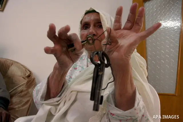 A Palestinian refugee elderly woman Holds the keys, a day before Palestinians mark the 'Nakba' Day (Day of the catastrophe), in the Al Jalazoun refugee camp in the West Bank City of Ramallah on 14 May 2012. 'Nakba' Day f...