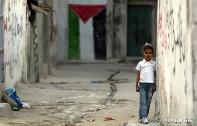 Palestinian refugee child plays outside her home, a day before Palestinians mark the 'Nakba' Day (Day of the catastrophe), in the Al amari refugee camp in the West Bank City of Ramallah on 14 May 2012. 'Nakba' Day for th...