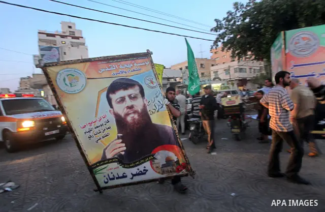 Relatives of Palestinian prisoners held in Israeli jails celebrate after the signing of a deal to end the prisoners hunger strike in Gaza City on 14 May 2012. Israel and Palestinian signed an agreement 14 May ending a ma...
