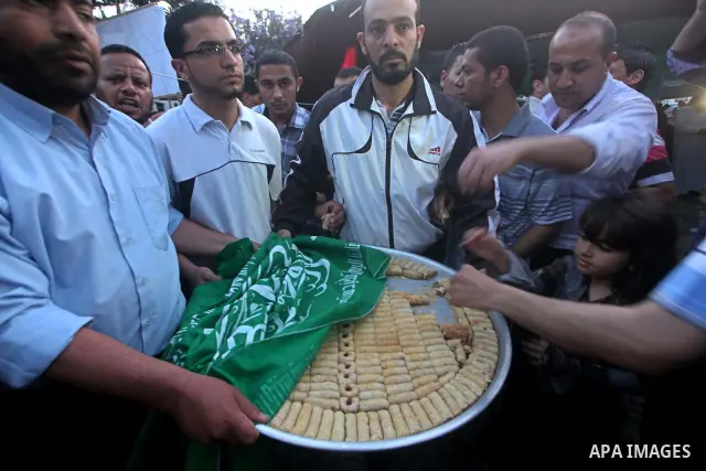 Relatives of Palestinian prisoners held in Israeli jails celebrate after the signing of a deal to end the prisoners hunger strike in Gaza City on 14 May 2012. Israel and Palestinian signed an agreement 14 May ending a ma...