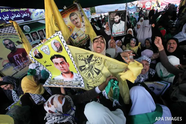 Relatives of Palestinian prisoners held in Israeli jails celebrate after the signing of a deal to end the prisoners hunger strike in Gaza City on 14 May 2012. Israel and Palestinian signed an agreement 14 May ending a ma...