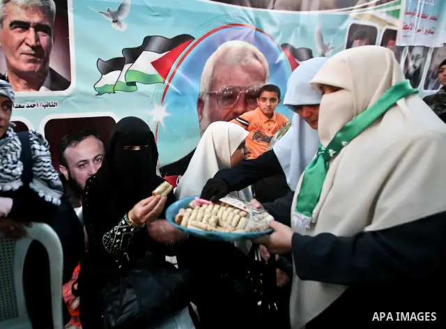 Relatives of Palestinian prisoners held in Israeli jails celebrate after the signing of a deal to end the prisoners hunger strike in Gaza City on 14 May 2012. Israel and Palestinian signed an agreement 14 May ending a ma...