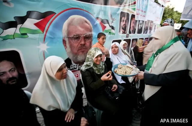 Relatives of Palestinian prisoners held in Israeli jails celebrate after the signing of a deal to end the prisoners hunger strike in Gaza City on 14 May 2012. Israel and Palestinian signed an agreement 14 May ending a ma...