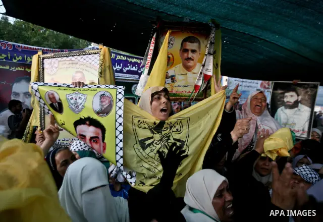 Relatives of Palestinian prisoners held in Israeli jails celebrate after the signing of a deal to end the prisoners hunger strike in Gaza City on 14 May 2012. Israel and Palestinian signed an agreement 14 May ending a ma...