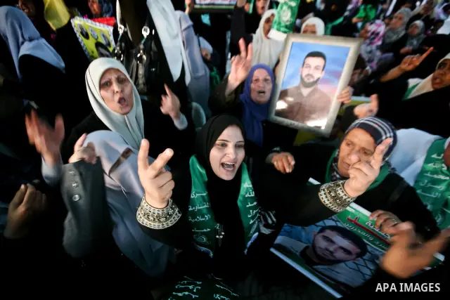 Relatives of Palestinian prisoners held in Israeli jails celebrate after the signing of a deal to end the prisoners hunger strike in Gaza City on 14 May 2012. Israel and Palestinian signed an agreement 14 May ending a ma...