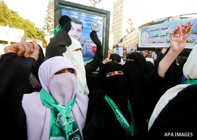 Relatives of Palestinian prisoners held in Israeli jails celebrate after the signing of a deal to end the prisoners hunger strike in Gaza City on 14 May 2012. Israel and Palestinian signed an agreement 14 May ending a ma...