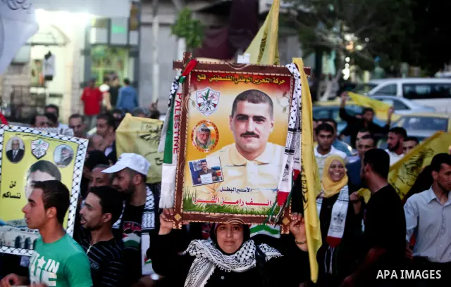Relatives of Palestinian prisoners held in Israeli jails celebrate after the signing of a deal to end the prisoners hunger strike in Gaza City on 14 May 2012. Israel and Palestinian signed an agreement 14 May ending a ma...