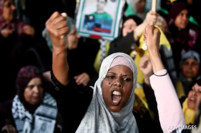 Relatives of Palestinian prisoners held in Israeli jails celebrate after the signing of a deal to end the prisoners hunger strike in Gaza City on 14 May 2012. Israel and Palestinian signed an agreement 14 May ending a ma...