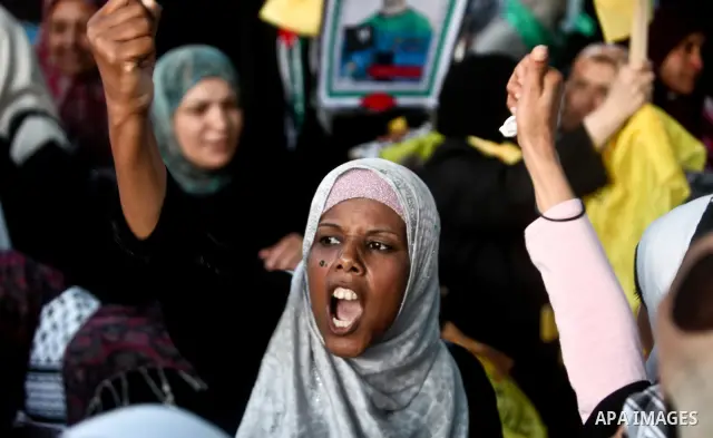Relatives of Palestinian prisoners held in Israeli jails celebrate after the signing of a deal to end the prisoners hunger strike in Gaza City on 14 May 2012. Israel and Palestinian signed an agreement 14 May ending a ma...
