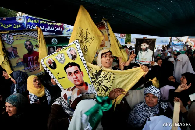 Relatives of Palestinian prisoners held in Israeli jails celebrate after the signing of a deal to end the prisoners hunger strike in Gaza City on 14 May 2012. Israel and Palestinian signed an agreement 14 May ending a ma...