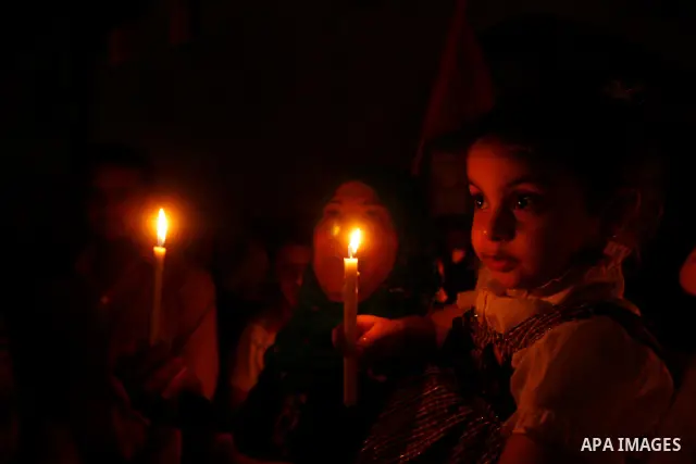 Palestinian children hold candles during a rally in Khan Younis in the southern Gaza Strip, ahead of Nakba May 14, 2012. On May 15 Palestinians will mark Nakba, or catastrophe, of Israel's founding in a 1948 war, when hu...