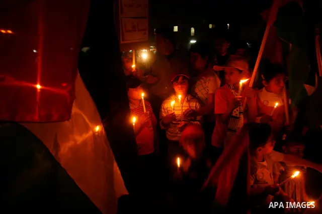 Palestinian children hold candles during a rally in Khan Younis in the southern Gaza Strip, ahead of Nakba May 14, 2012. On May 15 Palestinians will mark Nakba, or catastrophe, of Israel's founding in a 1948 war, when hu...