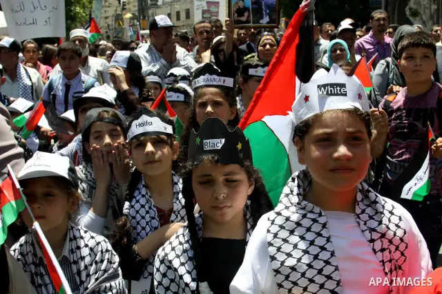 Palestinians take part in a demonstration to mark the 64th anniversary of "Nakba" (catastrophe), in the West Bank city of Nablus, on May 15, 2012. 'Nakba' Day for the Palestinians is an annual day of commemoration of the...