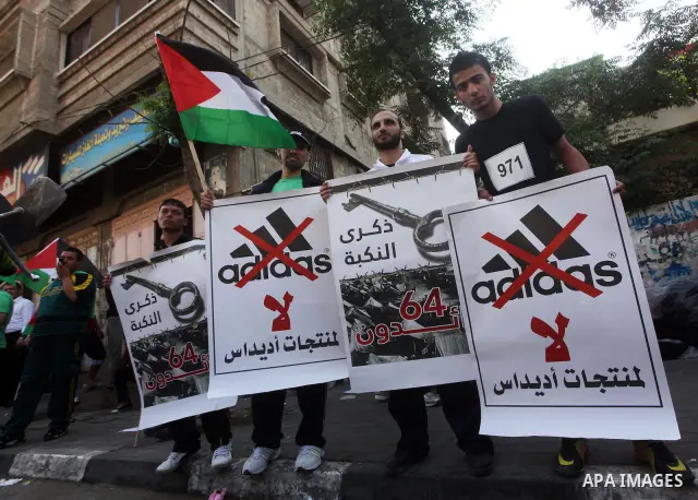 Palestinian protesters hold portraits, during a marathonin, participate the head of Gaza's Hamas government, Ismail Haniya Gaza on May 15, 2012. 'Nakba' Day for the Palestinians is an annual day of commemoration of the d...