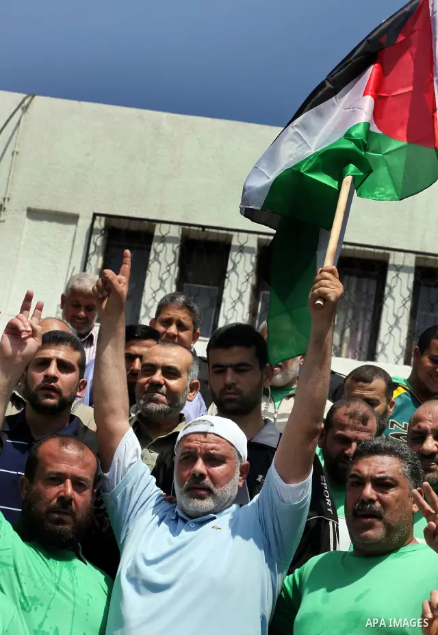 The head of Gaza's Hamas government, Ismail Haniya (blue polo shirt), takes part in a marathonin Gaza on May 15, 2012. 'Nakba' Day for the Palestinians is an annual day of commemoration of the displacement that followed...