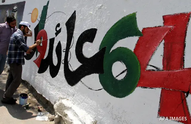 Palestinian artists paint murals marking Nakba in Gaza City May 15, 2012. Palestinians mark Nakba, or catastrophe, of Israel's founding in a 1948 war, when hundreds of thousands of their brethren fled or were forced to l...