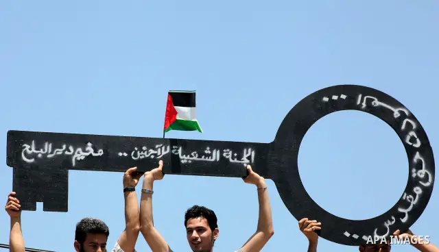 Palestinians hold keys symbolizing keys to houses left by Palestinians in 1948. Palestinians take part in a mass demonstration in front of UN headquarters of UNESCO marking Nakba when Palestinians were forced to leave th...