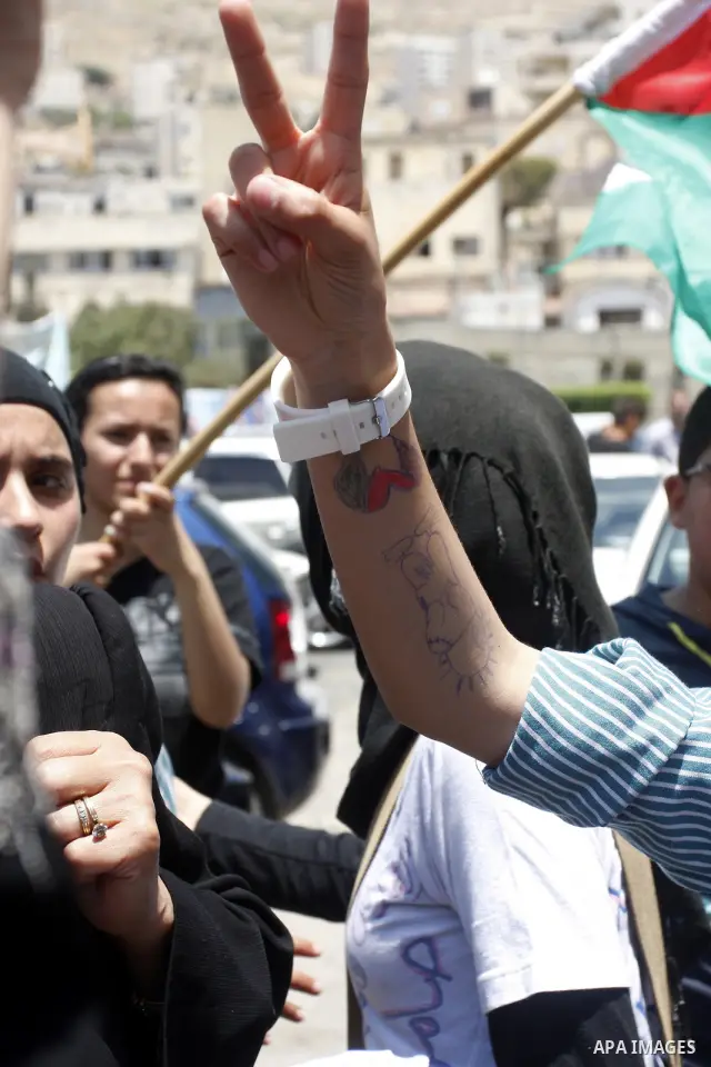 Palestinians participate in a rally marking the 64th anniversary of "Nakba", Arabic for catastrophe, the term used to mark the events leading to Israel's founding in 1948, in the West Bank city of Nablus, Tuesday, May 15...