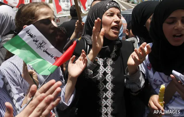 Palestinian women shout slogans against Israel during a rally marking the 64th anniversary of the 'Nakba' ('catastrophe') in Nablus, the West Bank, 15 May 2012. Thousands marched in the West Bank and Gaza Strip, commemor...