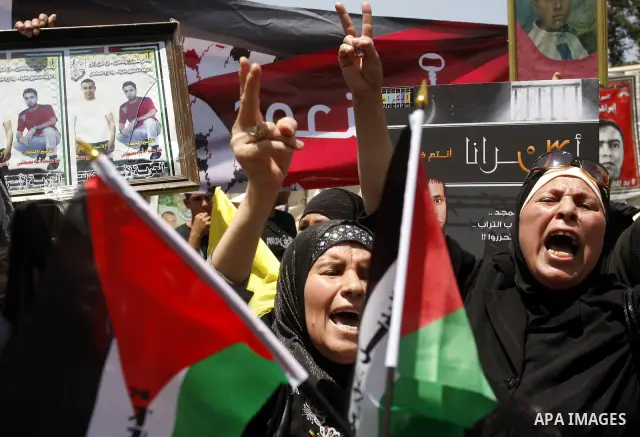 Palestinian women shout slogans against Israel during a rally marking the 64th anniversary of the 'Nakba' ('catastrophe') in Nablus, the West Bank, 15 May 2012. Thousands marched in the West Bank and Gaza Strip, commemor...