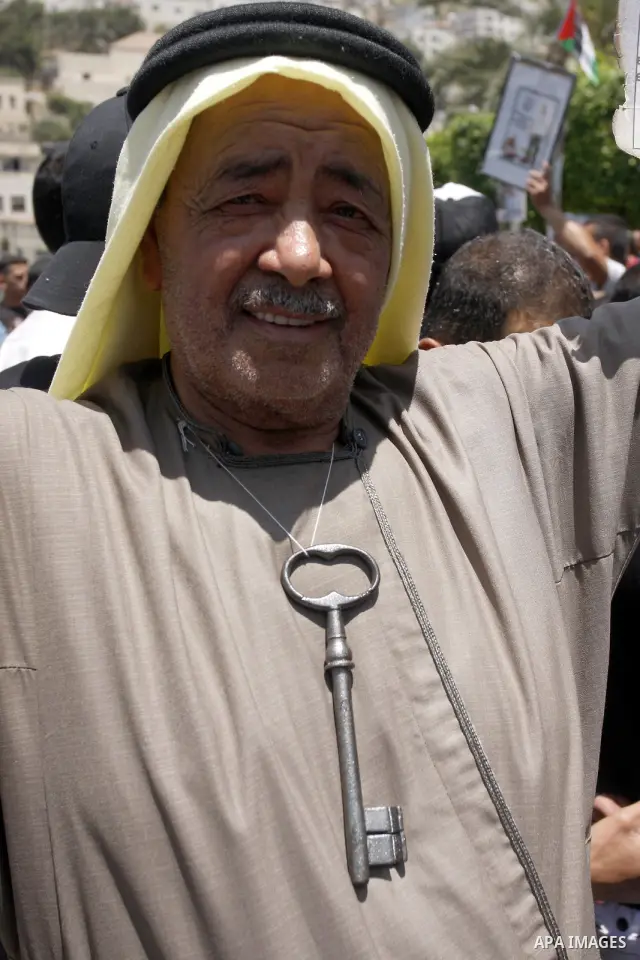 Palestinians hold certificate during a protest marking the anniversary of the "Nakba", Arabic for catastrophe , during a rally marking the 64rd anniversary of the Nakba, or catastrophe, the Arabic term used to describe t...