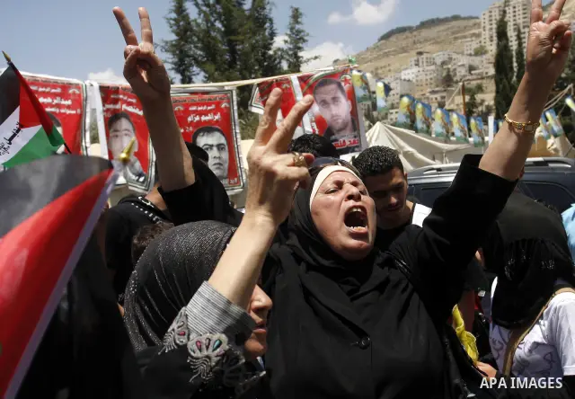 Palestinian women shout slogans against Israel during a rally marking the 64th anniversary of the 'Nakba' ('catastrophe') in Nablus, the West Bank, 15 May 2012. Thousands marched in the West Bank and Gaza Strip, commemor...