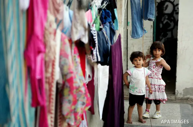 Palestinian children play in front of their homes in the Shati Palestinian refugee camp in Gaza City on May 15, 2012, as Palestinians and Arab-Israelis marked Nakba day, which commemorates the exodus of hundreds of thous...