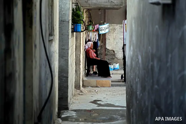 Palestinian children play in front of their homes in the Shati Palestinian refugee camp in Gaza City on May 15, 2012, as Palestinians and Arab-Israelis marked Nakba day, which commemorates the exodus of hundreds of thous...