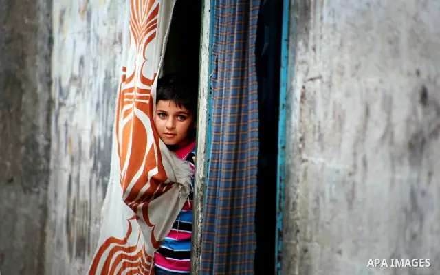 Palestinian children play in front of their homes in the Shati Palestinian refugee camp in Gaza City on May 15, 2012, as Palestinians and Arab-Israelis marked Nakba day, which commemorates the exodus of hundreds of thous...