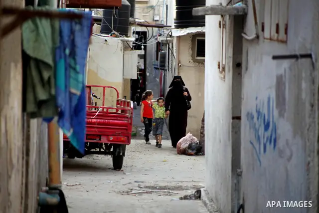 Palestinian children play in front of their homes in the Shati Palestinian refugee camp in Gaza City on May 15, 2012, as Palestinians and Arab-Israelis marked Nakba day, which commemorates the exodus of hundreds of thous...