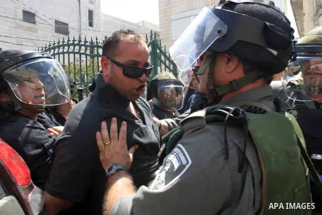 Israeli police officers detain a Palestinian after minor clashes between Palestinian stone-throwers and police in the East Jerusalem neighbourhood of Issawiya May 15, 2012. Israeli security forces were on high alert for...