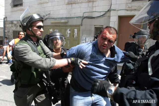Israeli police officers detain a Palestinian after minor clashes between Palestinian stone-throwers and police in the East Jerusalem neighbourhood of Issawiya May 15, 2012. Israeli security forces were on high alert for...