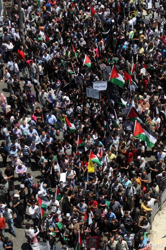Palestinians attend a rally marking Al-Nakba Day in the West Bank city of Ramallah, on May 15, 2012. The Palestinians continued to rally in the West Bank and the Gaza Strip to mark al- Nakba Day when thousands of Palesti...