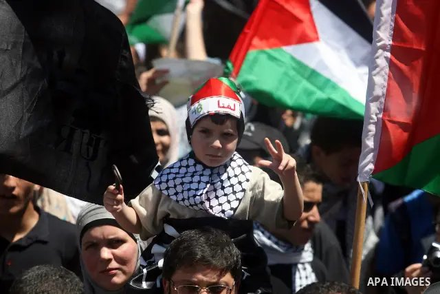 Palestinians attend a rally marking Al-Nakba Day in the West Bank city of Ramallah, on May 15, 2012. The Palestinians continued to rally in the West Bank and the Gaza Strip to mark al- Nakba Day when thousands of Palesti...