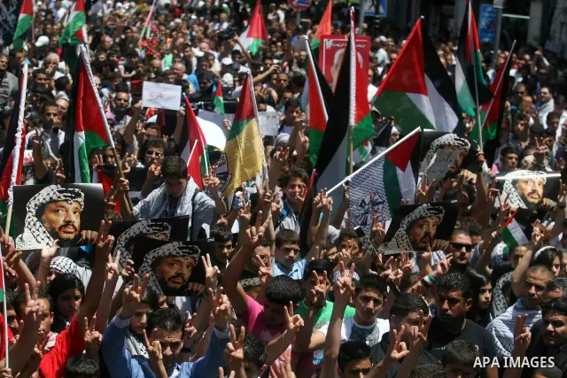 Palestinians attend a rally marking Al-Nakba Day in the West Bank city of Ramallah, on May 15, 2012. The Palestinians continued to rally in the West Bank and the Gaza Strip to mark al- Nakba Day when thousands of Palesti...
